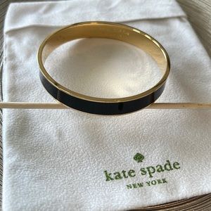 Kate Spade black & gold bracelet. Measures 2.5”. No clasp.
